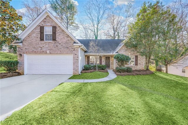 view of front of property featuring a front yard and a garage