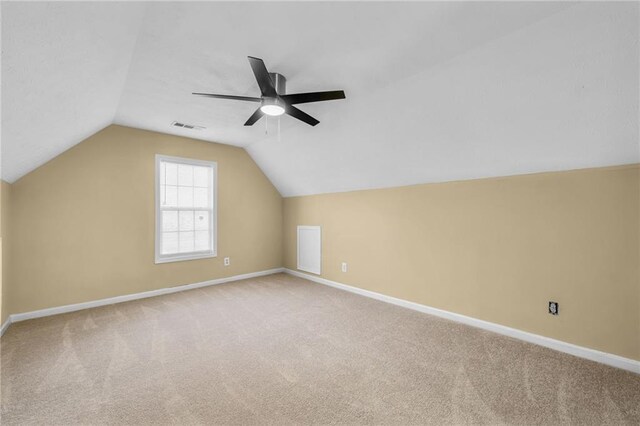 bonus room with carpet flooring, ceiling fan, and lofted ceiling