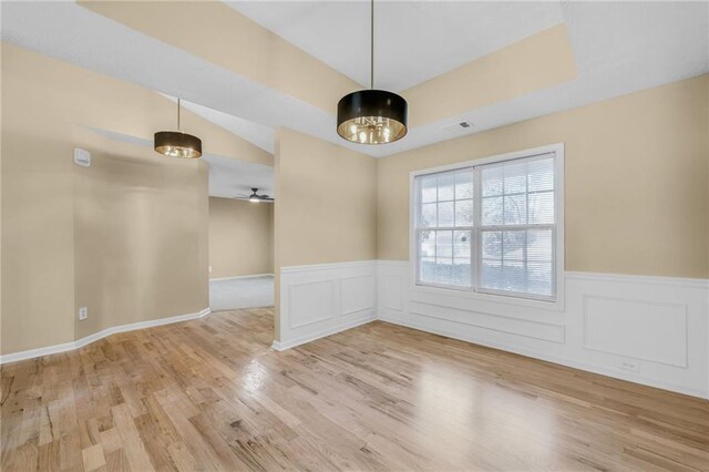 unfurnished dining area with ceiling fan and light hardwood / wood-style floors