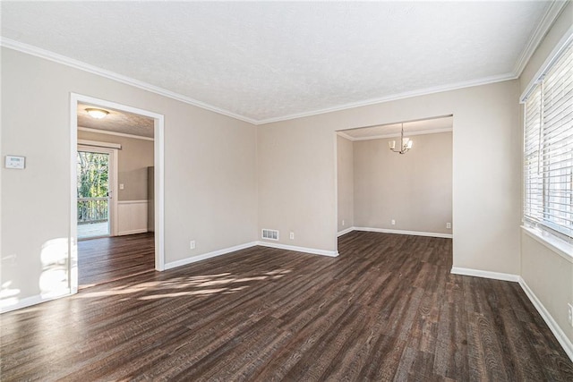 unfurnished room with a chandelier, a textured ceiling, dark hardwood / wood-style floors, and crown molding