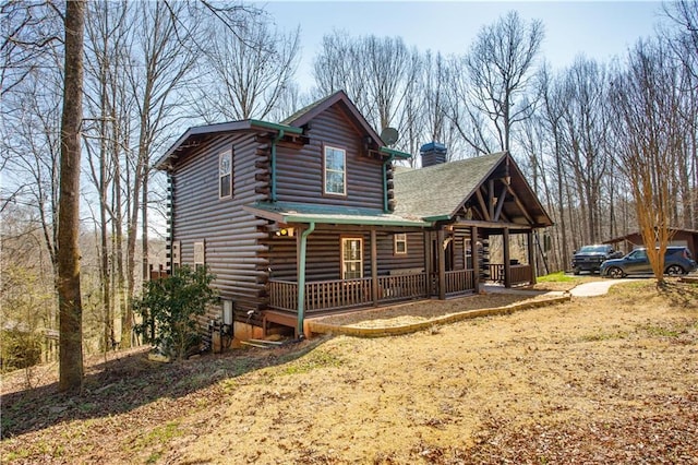 1225 Pitts Chapel, Newborn, GA 30056 - back of house featuring a porch, log siding, and a chimney