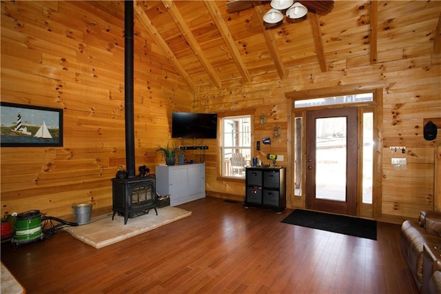 1225 Pitts Chapel, Newborn, GA 30056 - entrance foyer featuring wooden ceiling, a wood stove, beamed ceiling, a ceiling fan, and wood walls