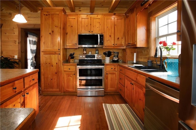 1225 Pitts Chapel, Newborn, GA 30056 - kitchen featuring stainless steel appliances, a sink, beamed ceiling, wood finished floors, and wood ceiling