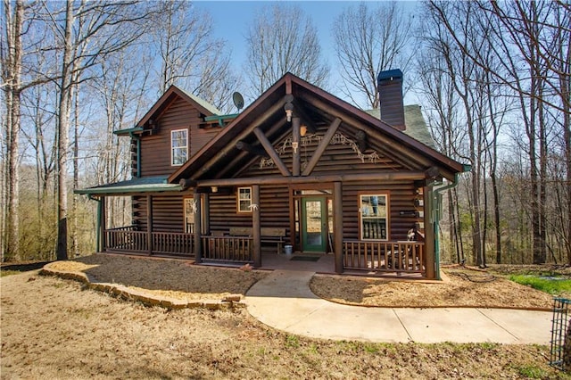 1225 Pitts Chapel, Newborn, GA 30056 - log-style house featuring a porch, log exterior, and a chimney