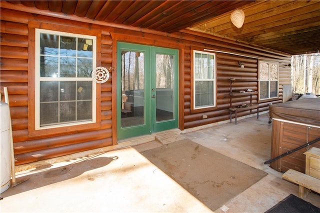 1225 Pitts Chapel, Newborn, GA 30056 - doorway to property with french doors, a hot tub, log veneer siding, and a patio area