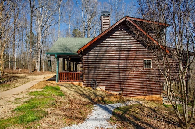 1225 Pitts Chapel, Newborn, GA 30056 - view of side of home with log siding and a chimney