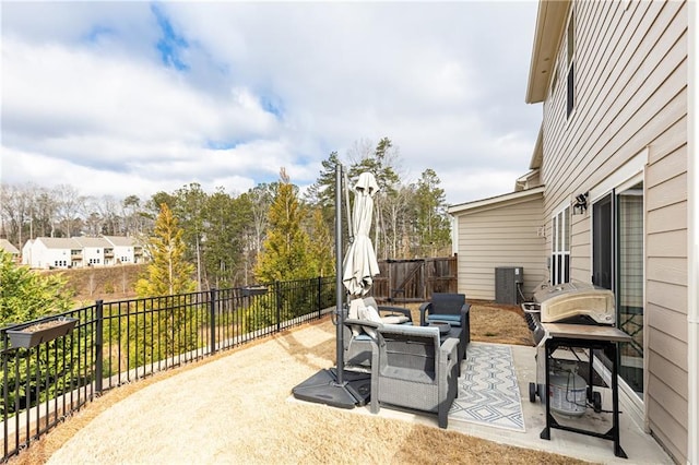 view of patio with an outdoor fire pit, a fenced backyard, and area for grilling