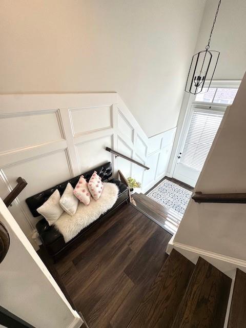 interior space with hardwood / wood-style flooring and an inviting chandelier