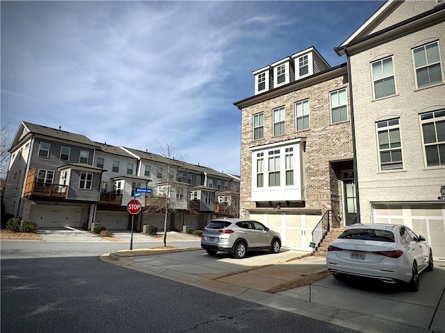 view of road featuring traffic signs, sidewalks, and a residential view