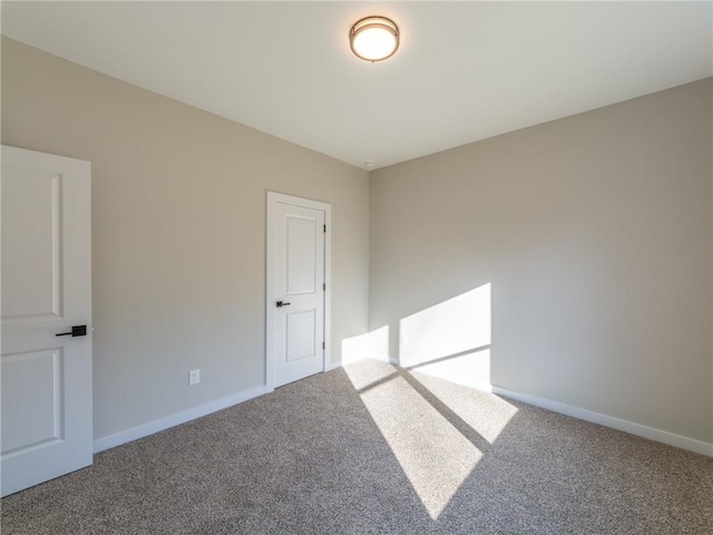 unfurnished room with carpet floors