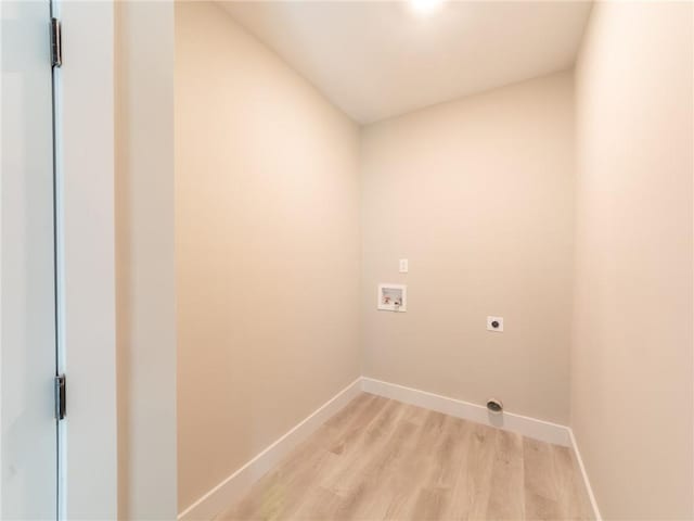 clothes washing area featuring washer hookup, electric dryer hookup, and light wood-type flooring