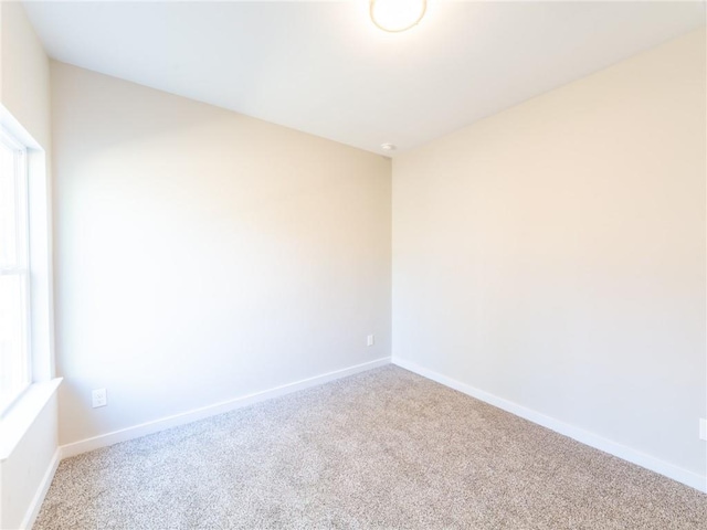 empty room with carpet flooring