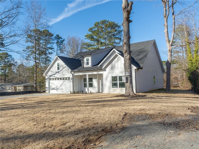 view of front facade with a front lawn and a garage