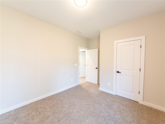 unfurnished room with carpet floors