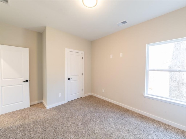 unfurnished room with carpet floors