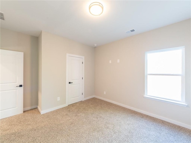 view of carpeted spare room