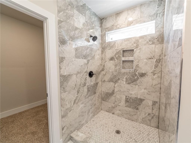 bathroom featuring a tile shower