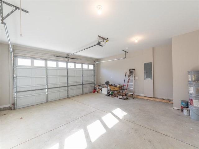 garage featuring a garage door opener and electric panel