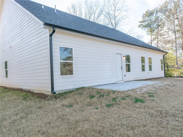 exterior space with a lawn and a patio