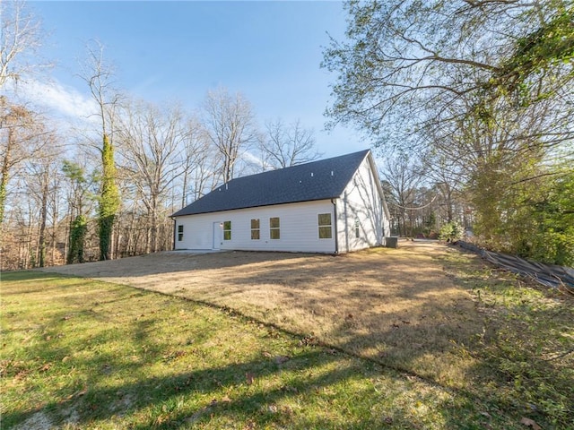 rear view of house with a yard