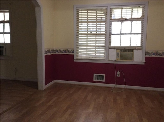 spare room with wood-type flooring and cooling unit