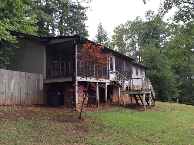 rear view of house with a lawn