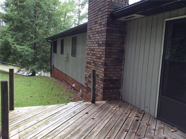 wooden deck with a yard