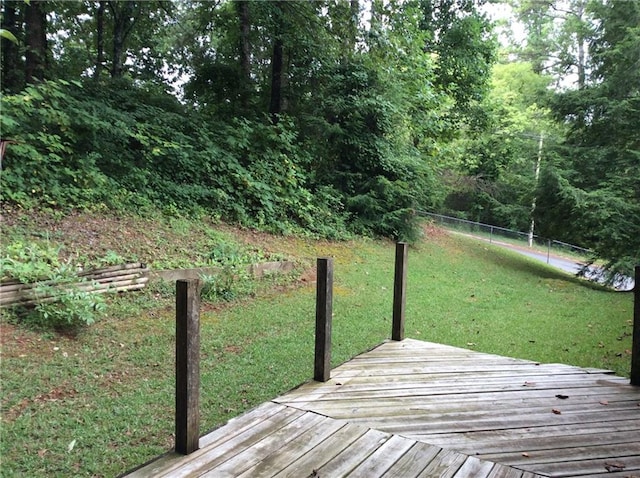 wooden deck with a yard