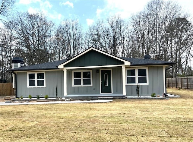 487 Eastside Dr, Dacula, GA 30019 - ranch-style house with covered porch, board and batten siding, a chimney, and roof with shingles