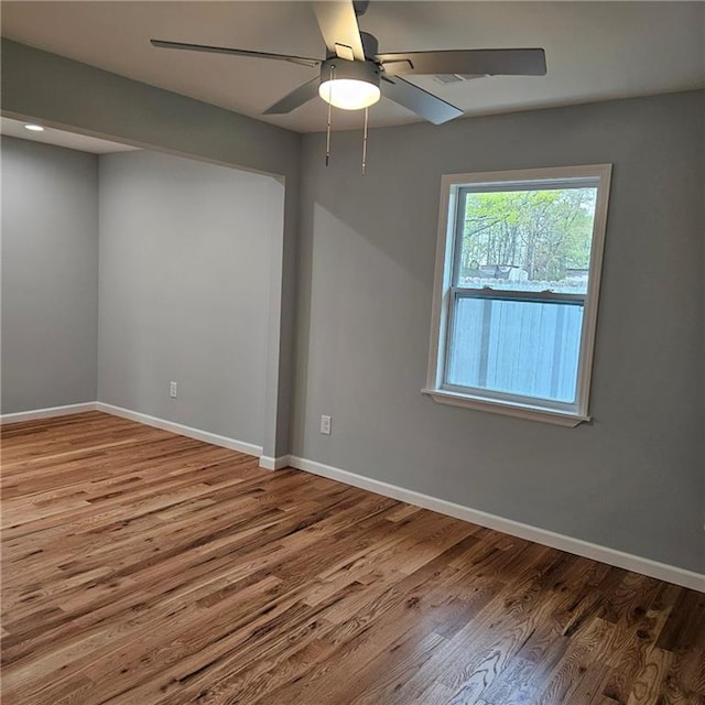 487 Eastside Dr, Dacula, GA 30019 - unfurnished room featuring wood finished floors, baseboards, and a ceiling fan