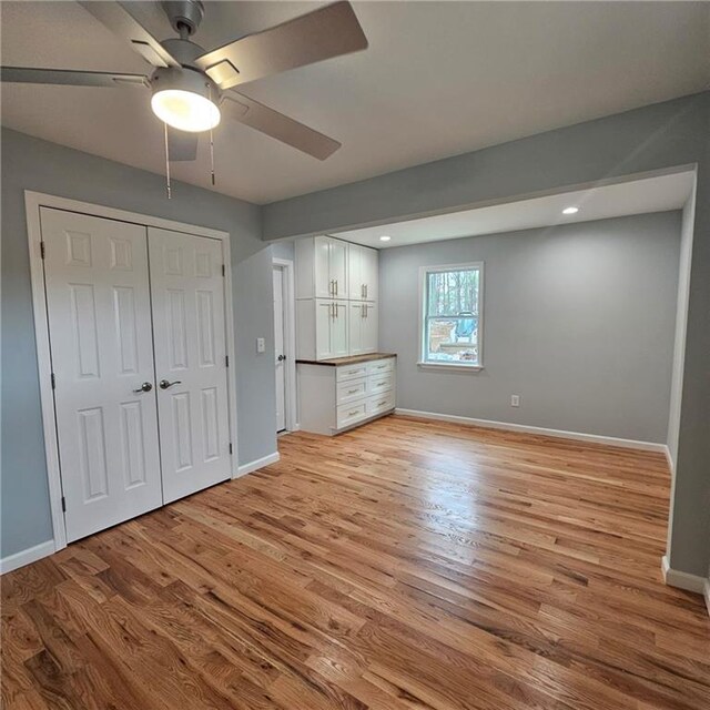 487 Eastside Dr, Dacula, GA 30019 - unfurnished bedroom with light wood-style flooring, baseboards, recessed lighting, a closet, and a ceiling fan