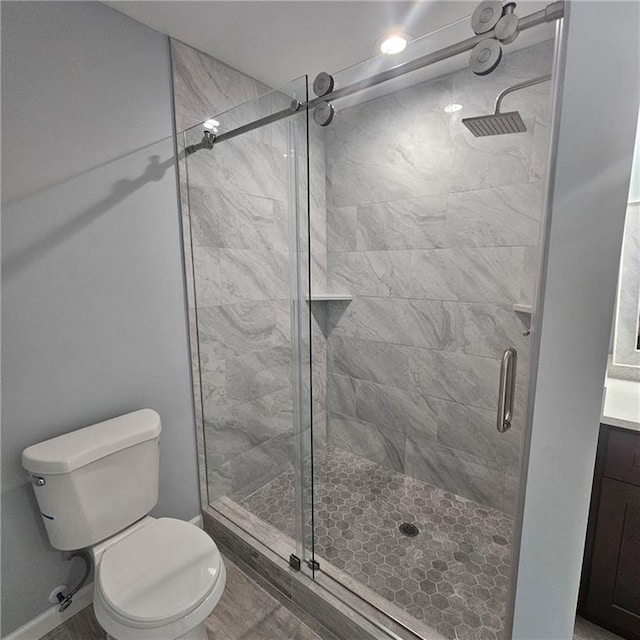 487 Eastside Dr, Dacula, GA 30019 - bathroom with a shower stall, toilet, and vanity