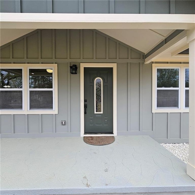 487 Eastside Dr, Dacula, GA 30019 - property entrance featuring board and batten siding and covered porch