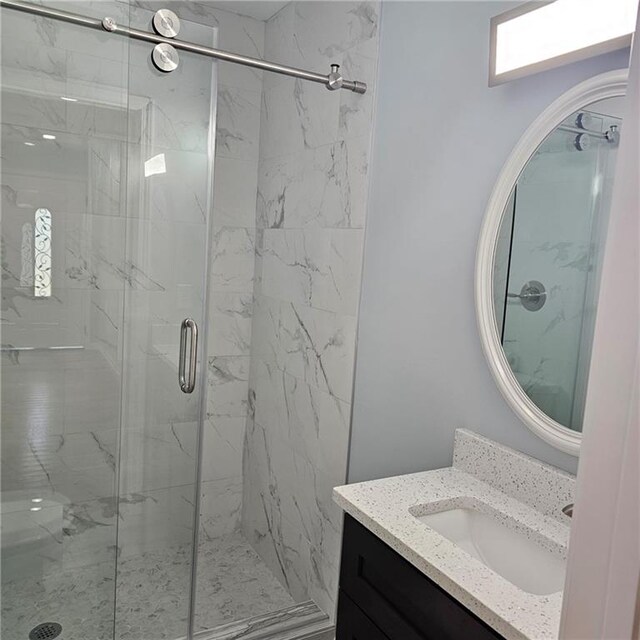 487 Eastside Dr, Dacula, GA 30019 - full bath featuring a marble finish shower and vanity