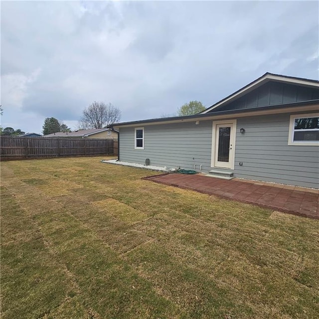 487 Eastside Dr, Dacula, GA 30019 - rear view of house featuring a patio area and board and batten siding