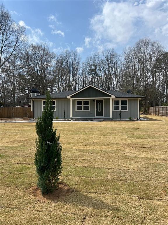 487 Eastside Dr, Dacula, GA 30019 - single story home with a porch and a chimney