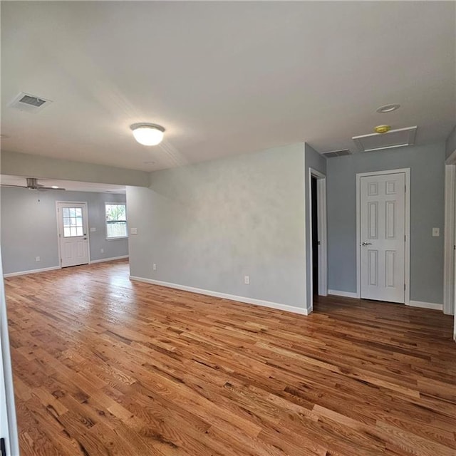 487 Eastside Dr, Dacula, GA 30019 - empty room with wood finished floors and baseboards