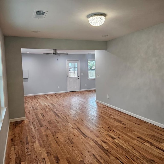 487 Eastside Dr, Dacula, GA 30019 - unfurnished room featuring wood finished floors, a ceiling fan, and baseboards