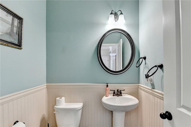 1211 Chapel Estates Way, Dacula, GA 30019 - bathroom featuring a wainscoted wall and toilet