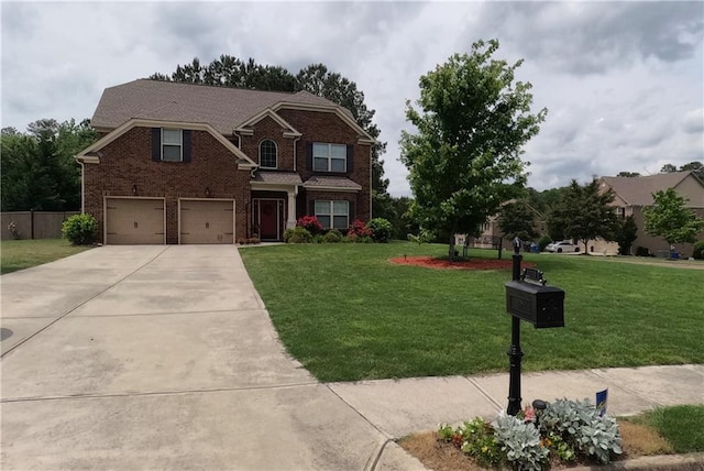 view of front of house with an attached garage, brick siding, a front yard, and concrete driveway