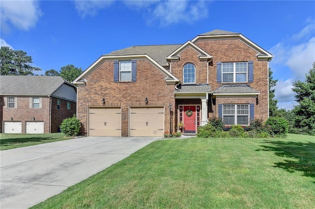 1211 Chapel Estates Way, Dacula, GA 30019 - view of front facade featuring an attached garage, brick siding, driveway, and a front lawn