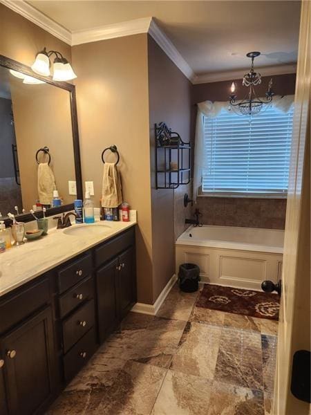 bathroom with a notable chandelier, ornamental molding, a bath, and vanity