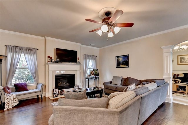 1211 Chapel Estates Way, Dacula, GA 30019 - living room featuring dark wood-style floors, a fireplace, a ceiling fan, crown molding, and ornate columns