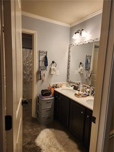 full bath featuring crown molding, a sink, and double vanity