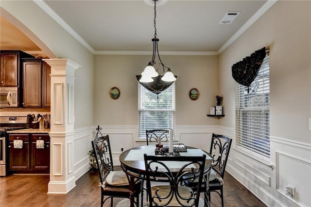 1211 Chapel Estates Way, Dacula, GA 30019 - dining area featuring a chandelier, dark wood-type flooring, a wainscoted wall, and ornamental molding