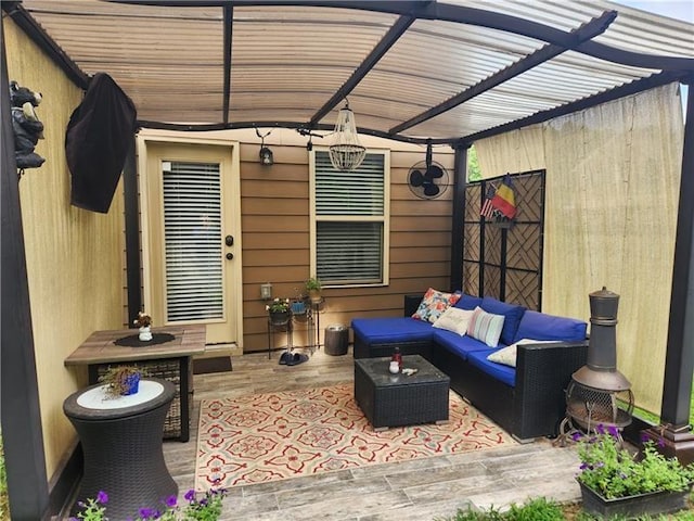 view of patio with an outdoor living space and a pergola