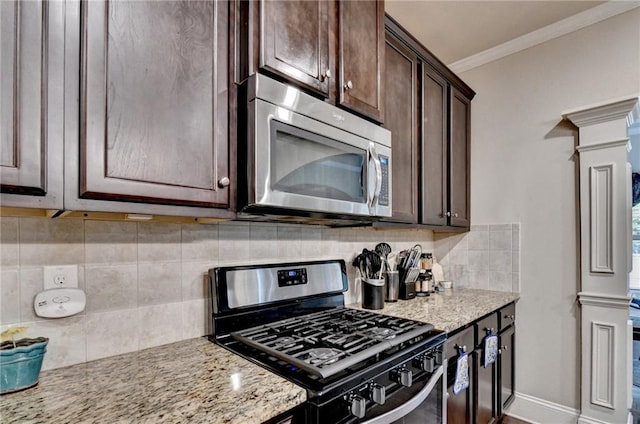 1211 Chapel Estates Way, Dacula, GA 30019 - kitchen with appliances with stainless steel finishes, ornate columns, dark brown cabinetry, light stone countertops, and decorative backsplash