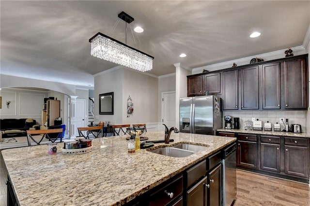 1211 Chapel Estates Way, Dacula, GA 30019 - kitchen featuring stainless steel appliances, ornate columns, arched walkways, dark brown cabinets, and ornamental molding