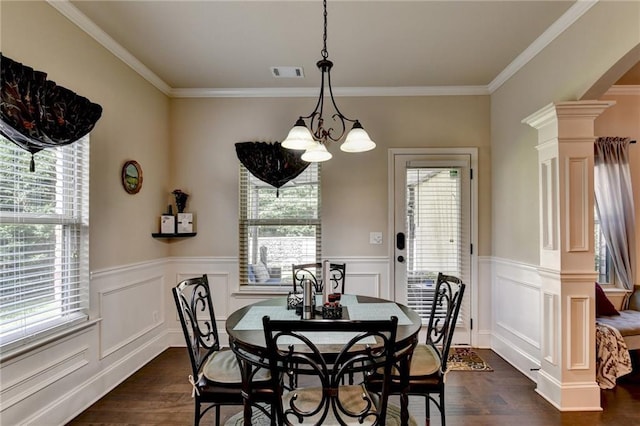 1211 Chapel Estates Way, Dacula, GA 30019 - dining room featuring decorative columns, plenty of natural light, dark wood-type flooring, ornamental molding, and a wainscoted wall