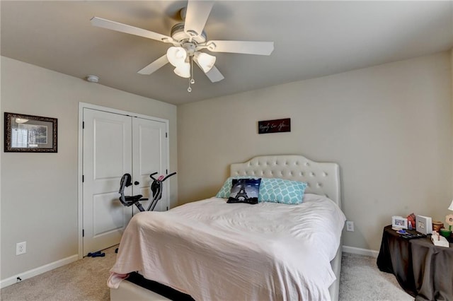 1211 Chapel Estates Way, Dacula, GA 30019 - bedroom with light colored carpet, a ceiling fan, and a closet